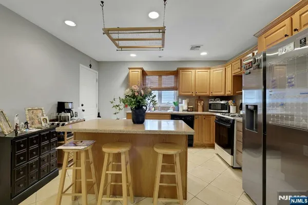a view of kitchen island with cabinets