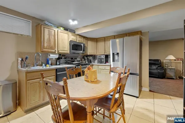 a kitchen with a dining table and chairs