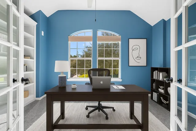 a view of a workspace with furniture