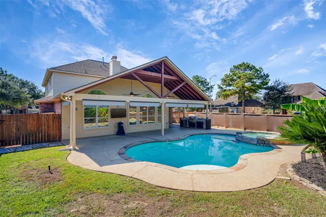 a view of a house with swimming pool yard and sitting area
