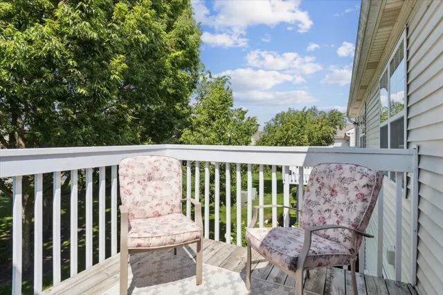 a view of a balcony with wooden floor