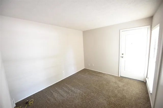 a white toilet and tub sitting next to a bathroom sink