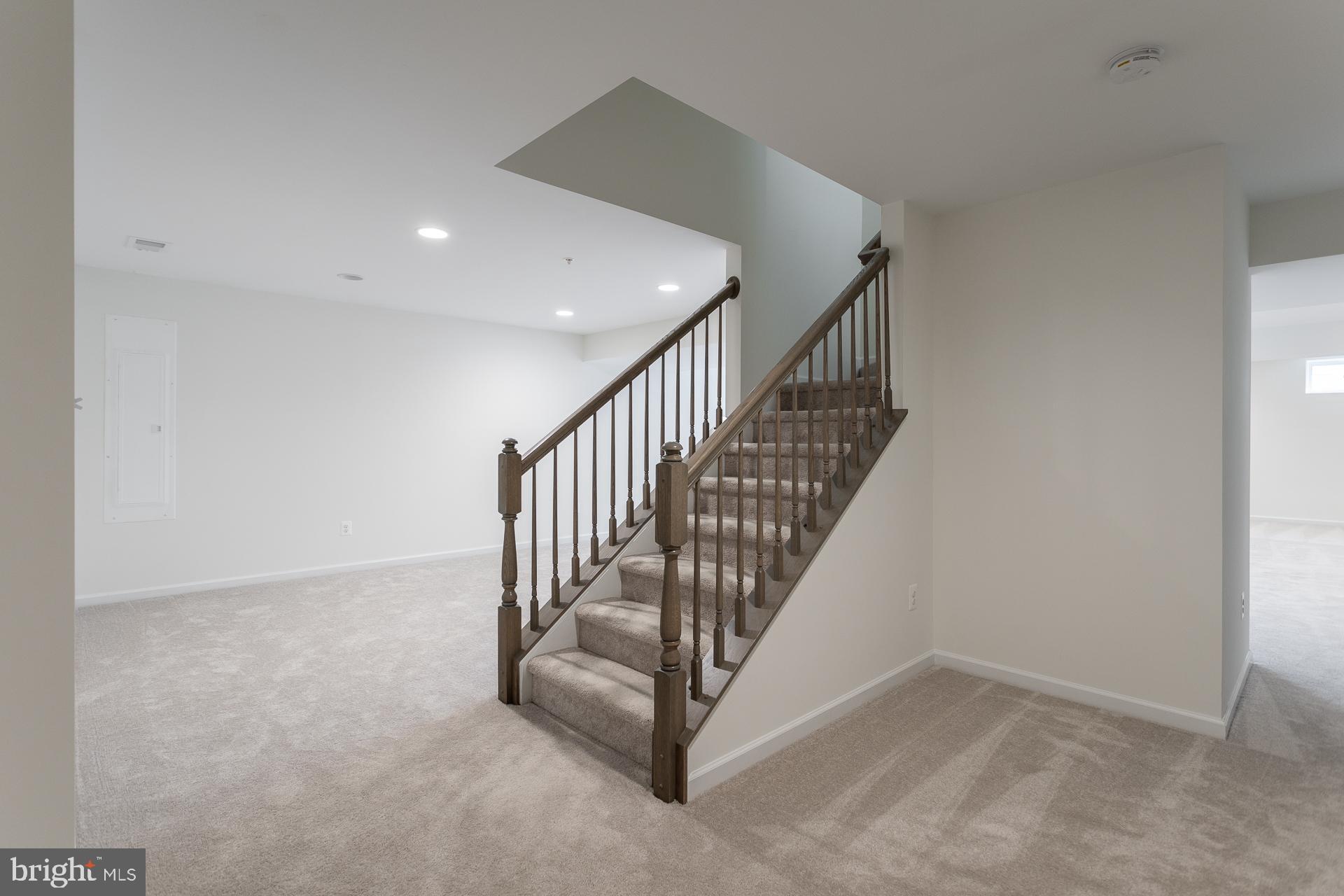 702 Marquee Farm Road Charles Town, WV 25414 - Photo 19 of 40 a view of a hallway with staircase
