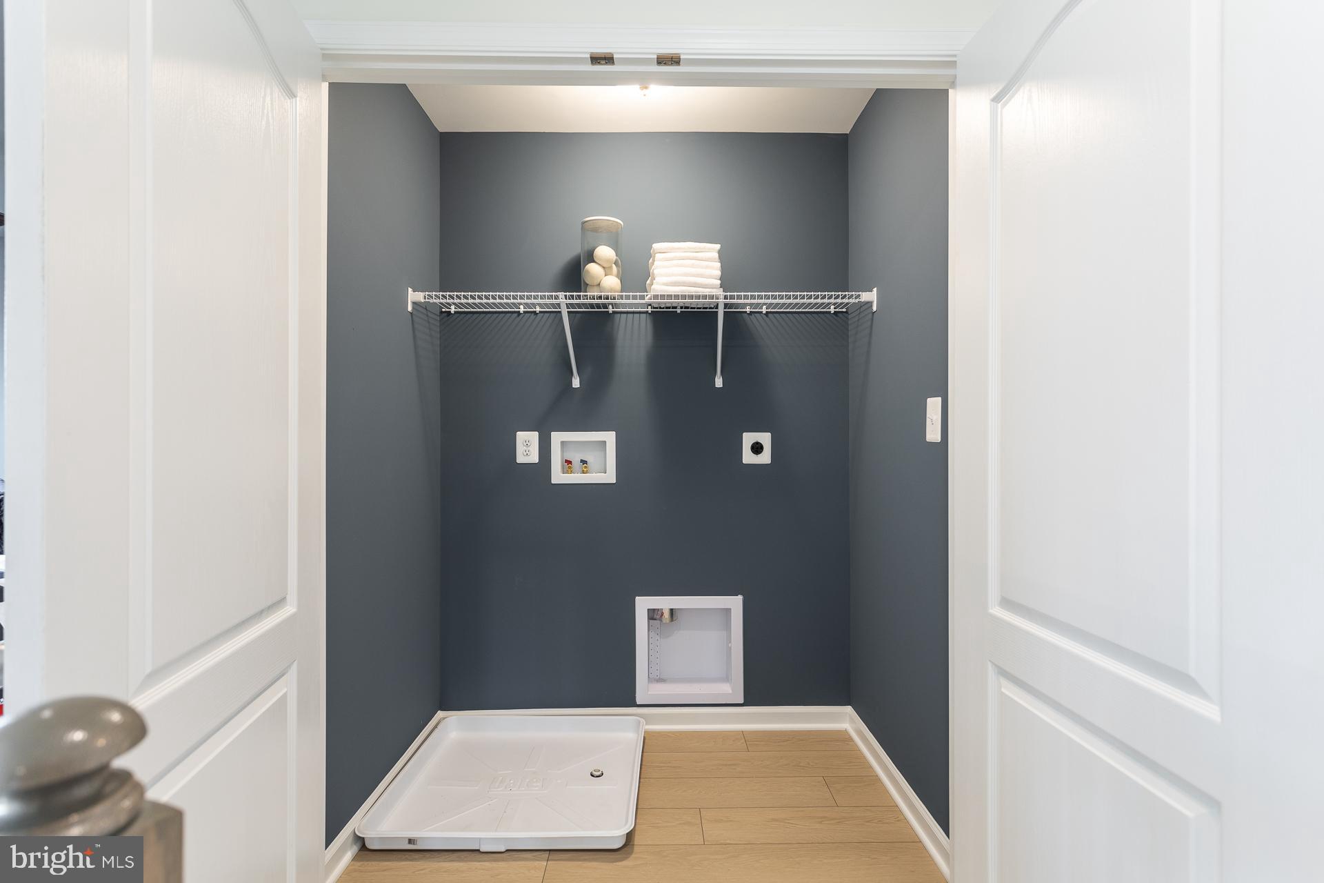 702 Marquee Farm Road Charles Town, WV 25414 - Photo 22 of 40 a view of cabinet with a chair and frames on wall