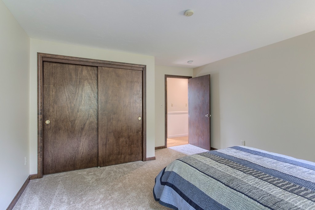 10 Farley Brook Road Chelmsford, MA 01824 - Photo 13 of 30 a bedroom with a bed and a mirror