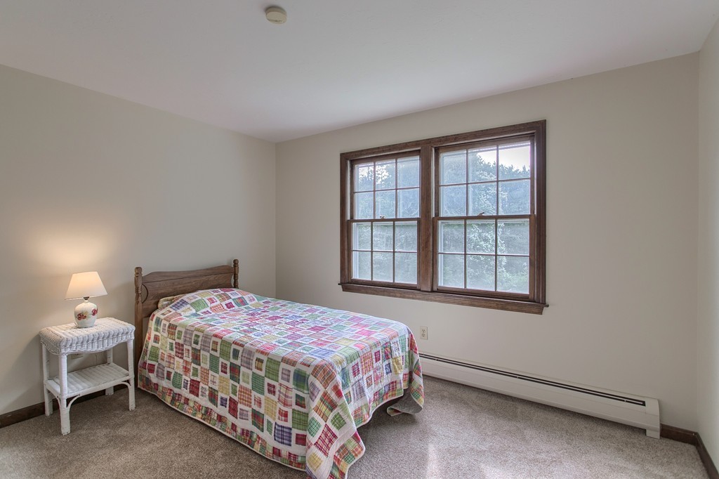 10 Farley Brook Road Chelmsford, MA 01824 - Photo 14 of 30 a bedroom with a bed and a window
