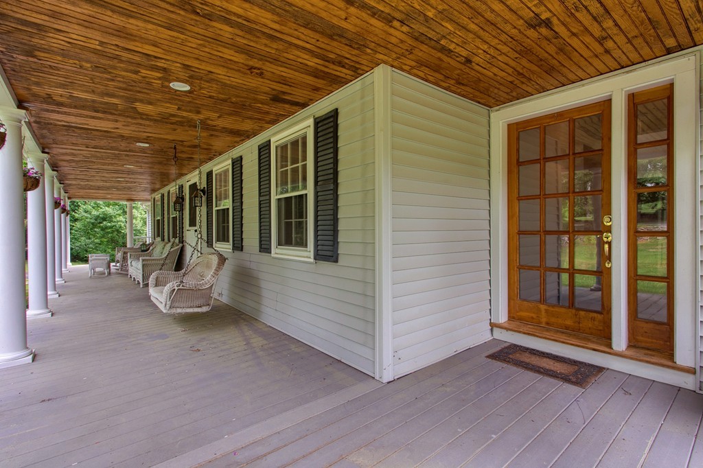 10 Farley Brook Road Chelmsford, MA 01824 - Photo 17 of 30 a view of a patio with table and chairs and wooden floor
