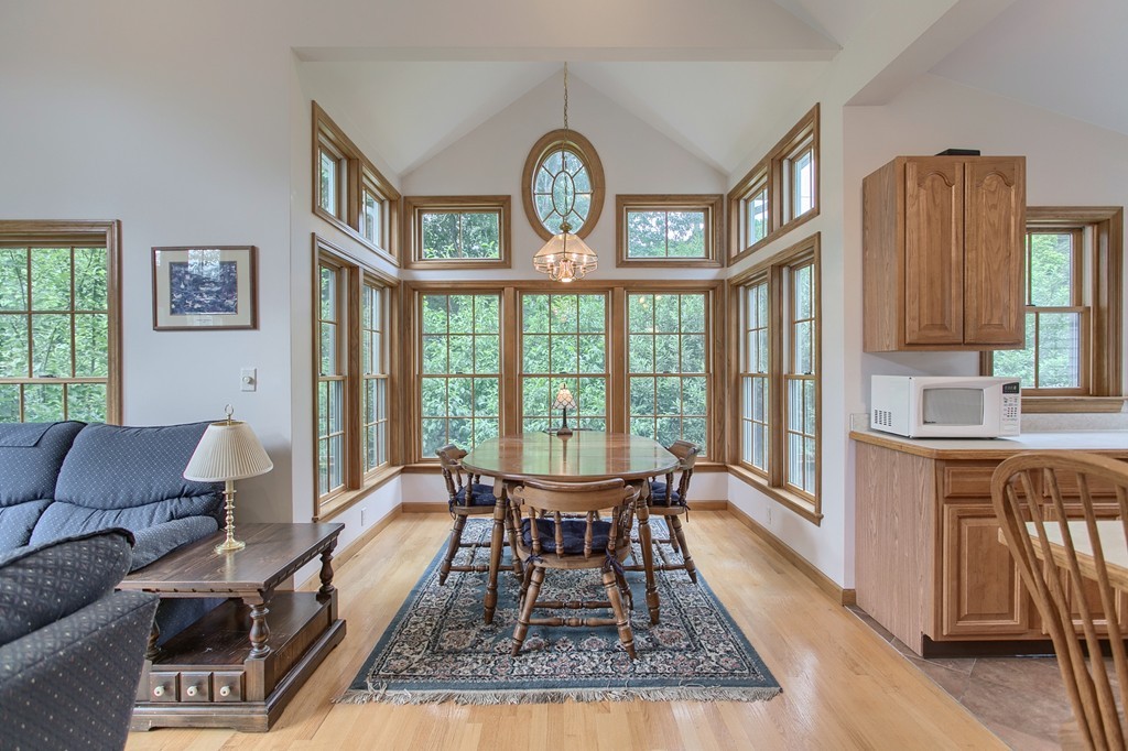 10 Farley Brook Road Chelmsford, MA 01824 - Photo 19 of 30 a dining room with furniture a rug and a large window