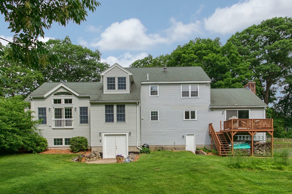 10 Farley Brook Road Chelmsford, MA 01824 - Photo 26 of 30 a front view of house with yard and green space