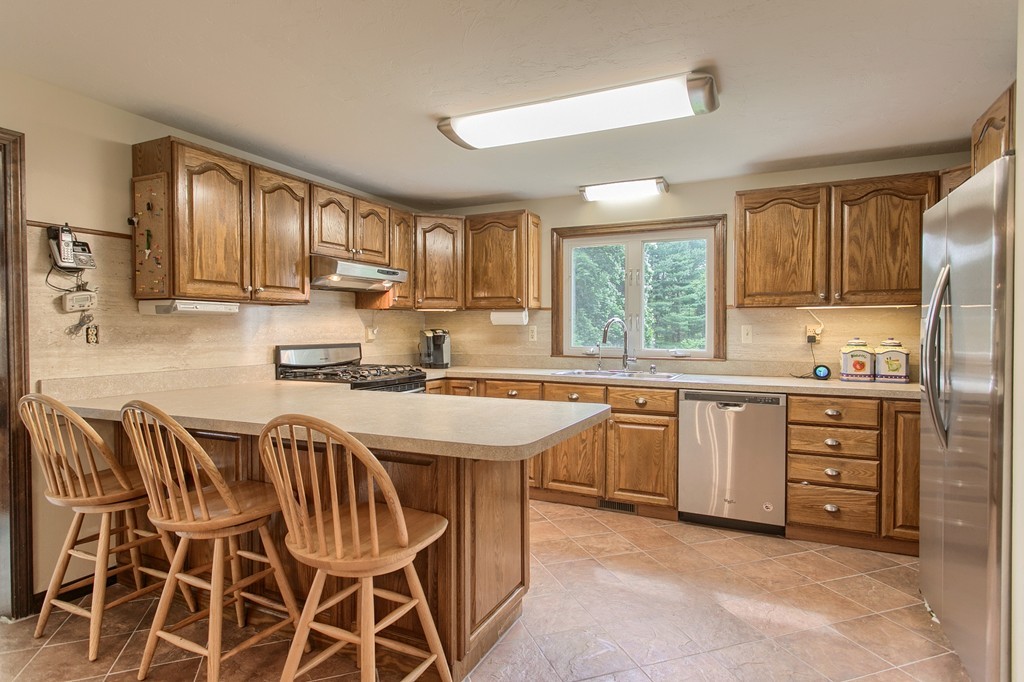 10 Farley Brook Road Chelmsford, MA 01824 - Photo 6 of 30 a kitchen with cabinets and window