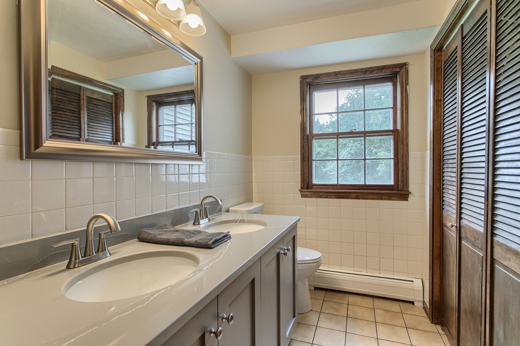 10 Farley Brook Road Chelmsford, MA 01824 - Photo 8 of 30 a bathroom with a sink and a toilet
