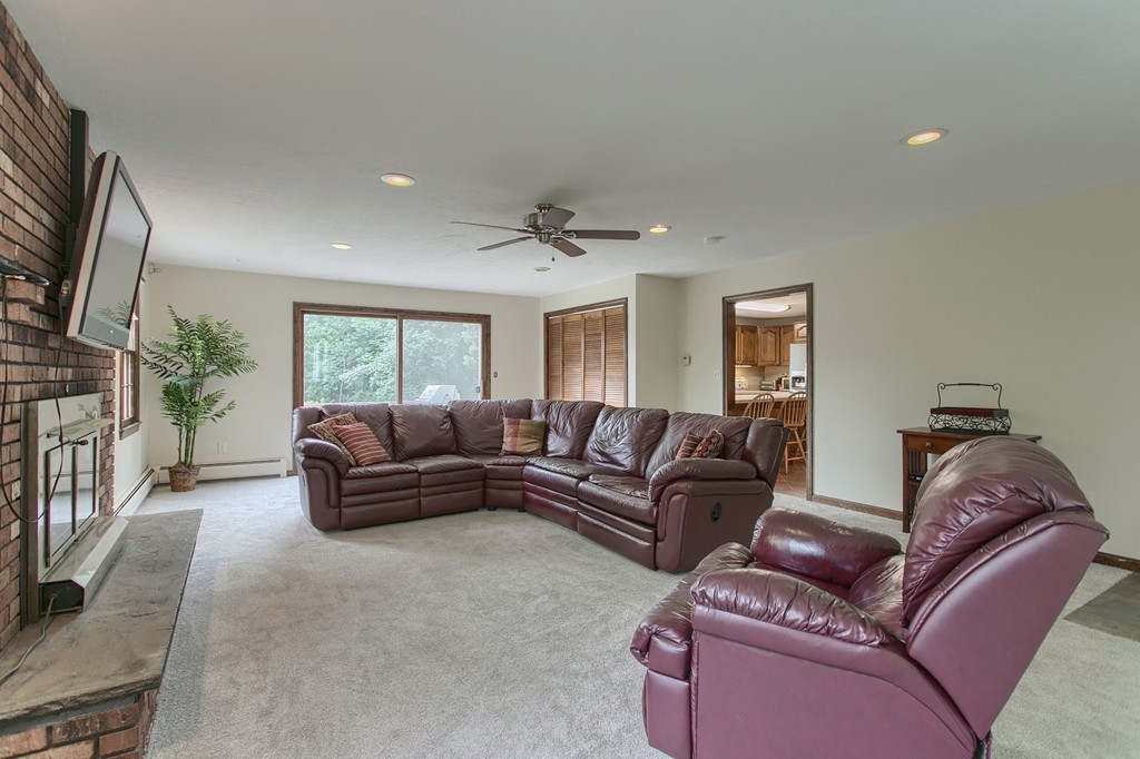 10 Farley Brook Road Chelmsford, MA 01824 - Photo 9 of 30 a living room with furniture a flat screen tv and a window