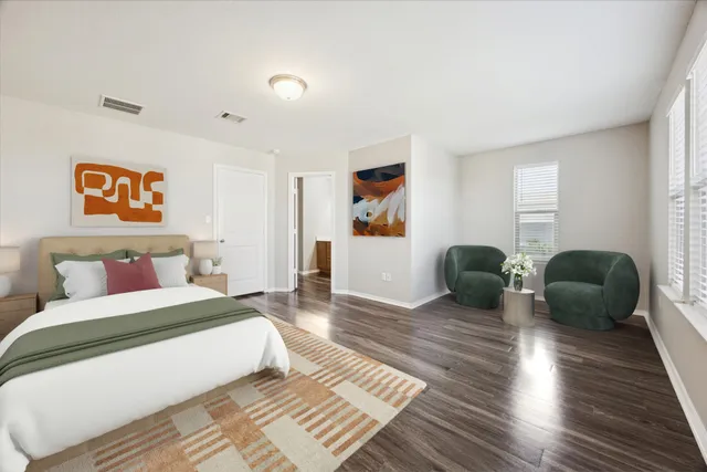 a bedroom with double bed and a couch