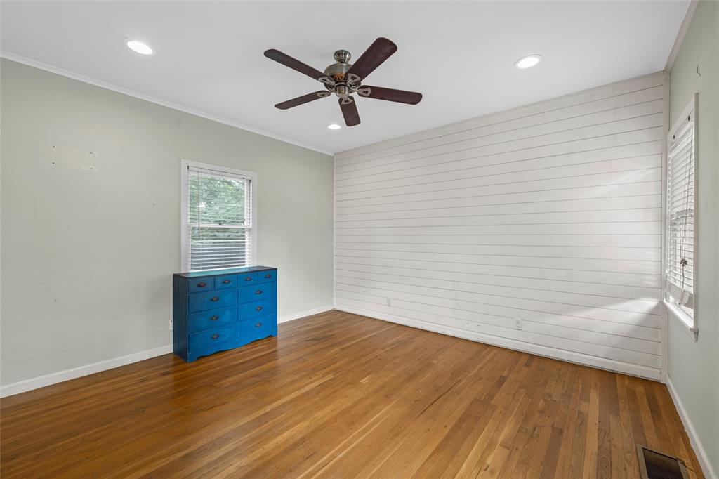 2717 Colcord Avenue Waco, TX 76707 - Photo 12 of 34 wooden floor in an empty room with a window