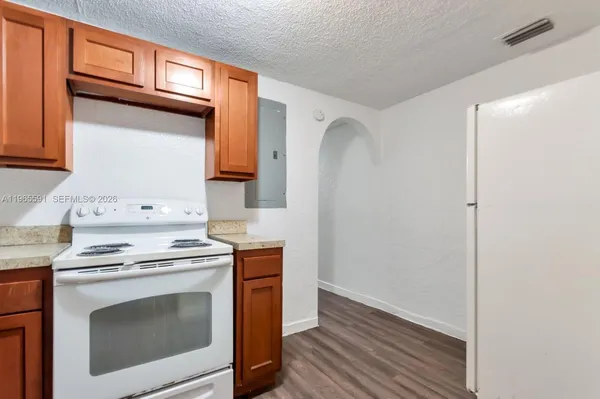 a kitchen with a stove and a microwave