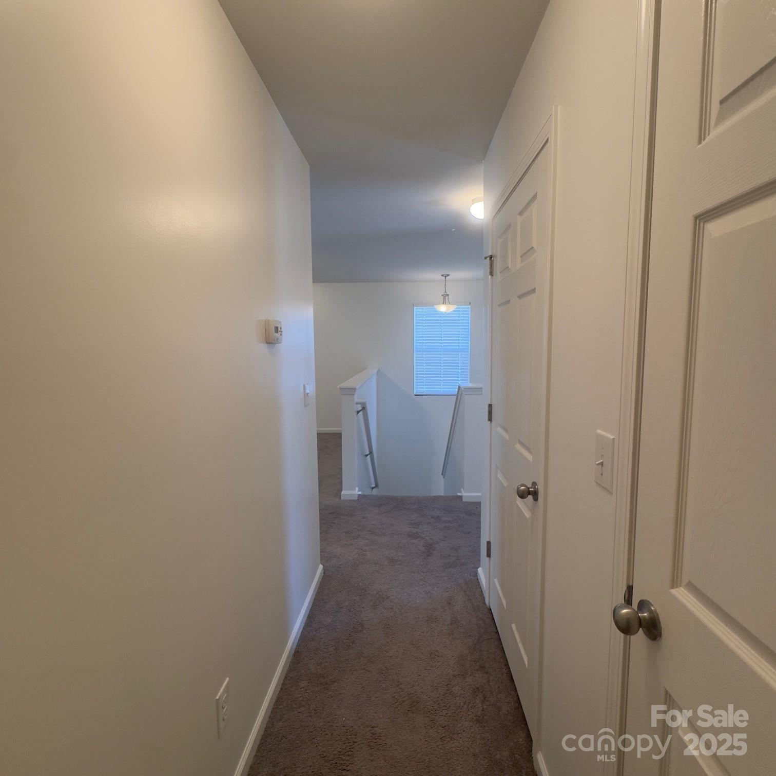 105 Abel Peterson Drive Mount Holly, NC 28120 - Photo 13 of 36 a view of a hallway with a room