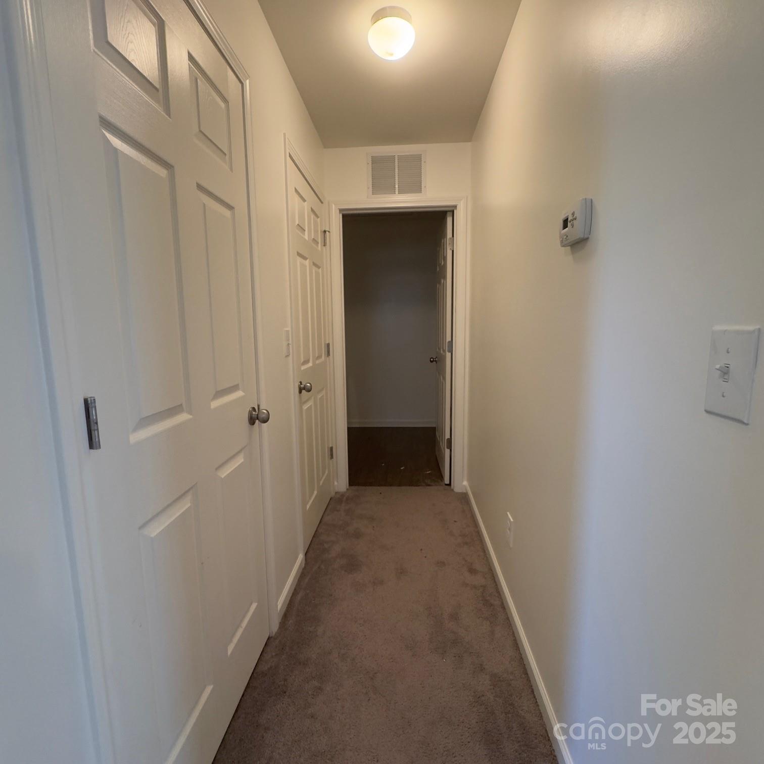 105 Abel Peterson Drive Mount Holly, NC 28120 - Photo 15 of 36 a view of a hallway with wooden floor