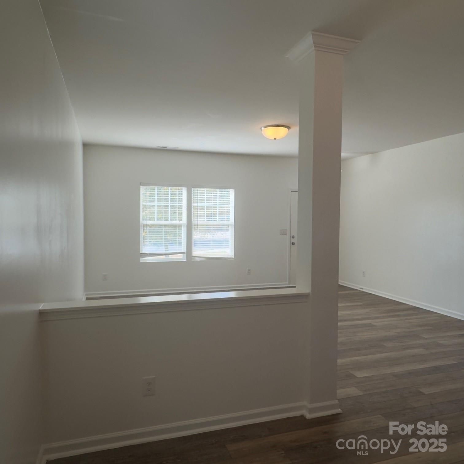 105 Abel Peterson Drive Mount Holly, NC 28120 - Photo 19 of 36 a view of empty room with wooden floor and fan