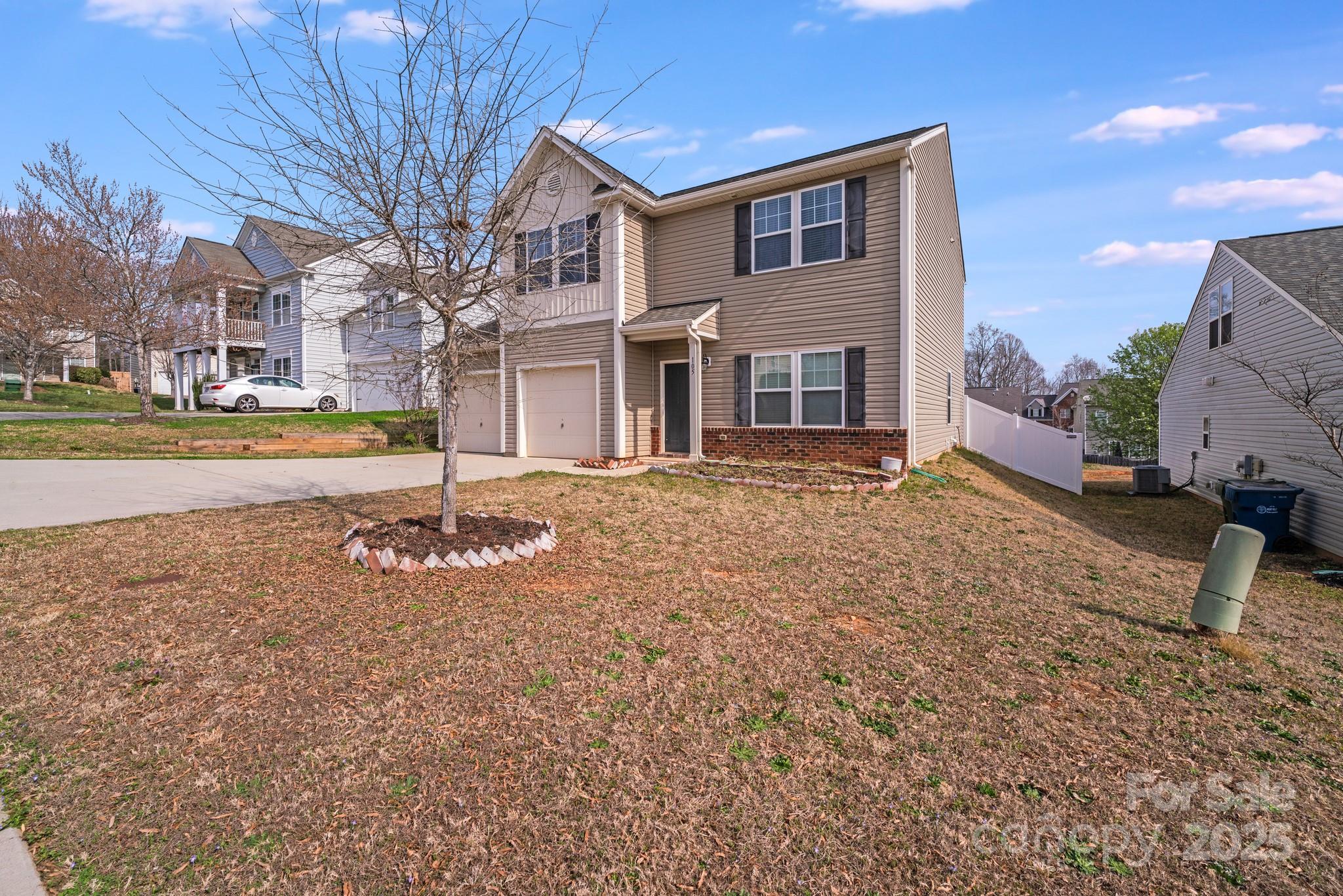 105 Abel Peterson Drive Mount Holly, NC 28120 - Photo 2 of 36 a front view of a house with a yard