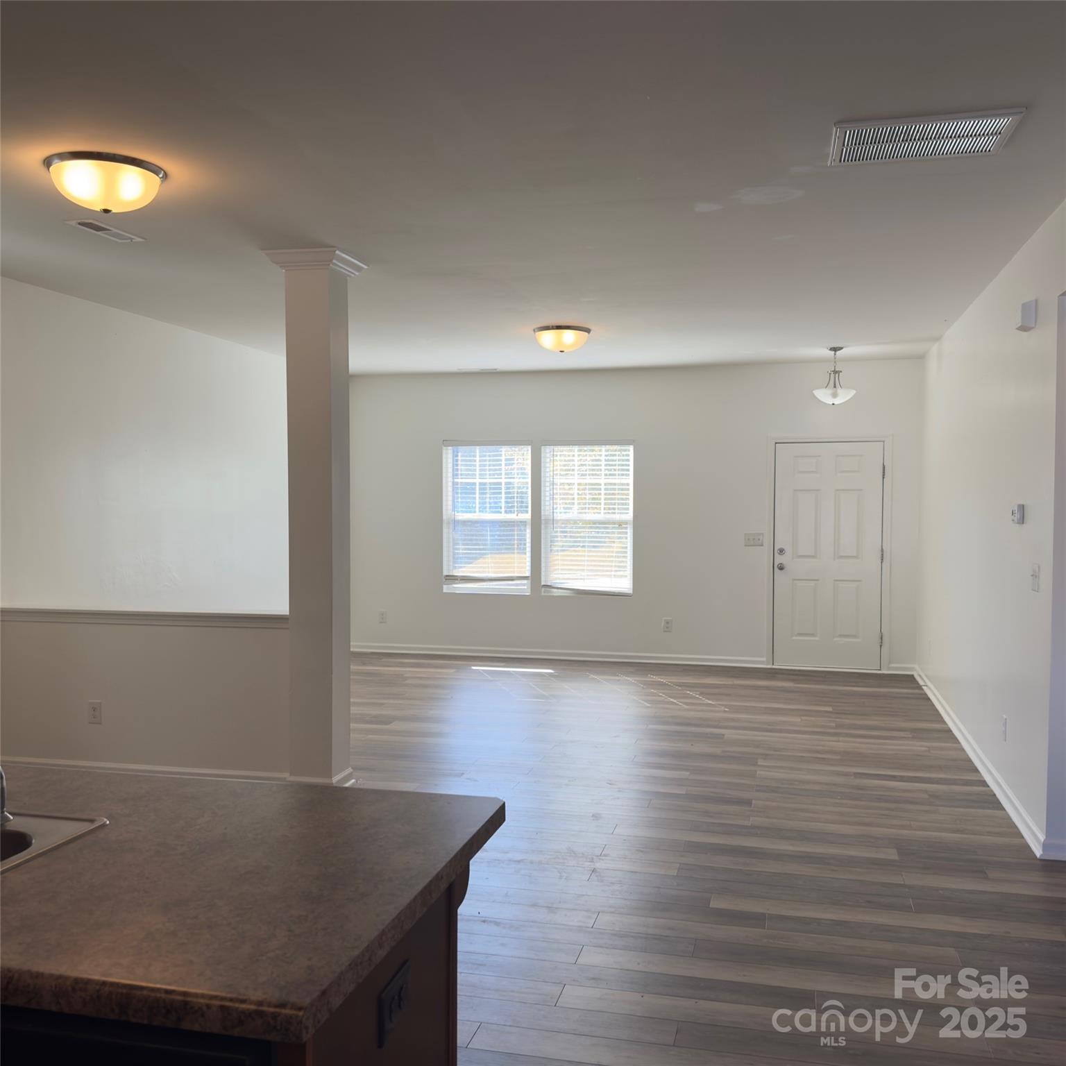 105 Abel Peterson Drive Mount Holly, NC 28120 - Photo 21 of 36 a room with wooden floor and window