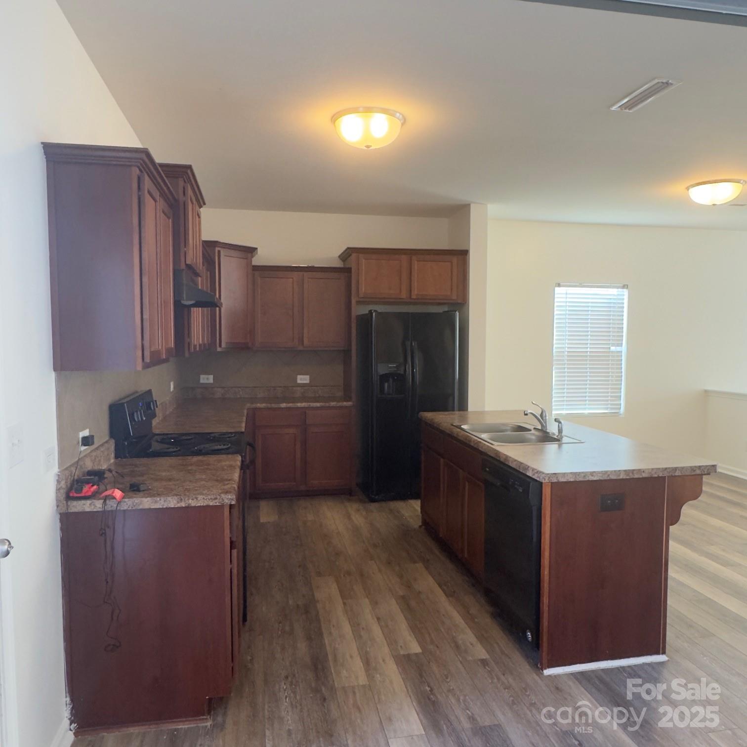 105 Abel Peterson Drive Mount Holly, NC 28120 - Photo 22 of 36 a kitchen with stainless steel appliances granite countertop a stove a refrigerator and a oven