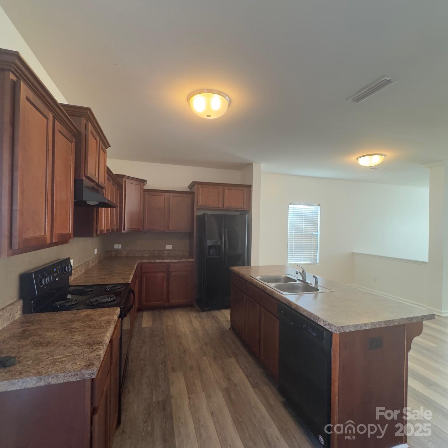 105 Abel Peterson Drive Mount Holly, NC 28120 - Photo 28 of 36 a kitchen with stainless steel appliances granite countertop a sink stove and refrigerator