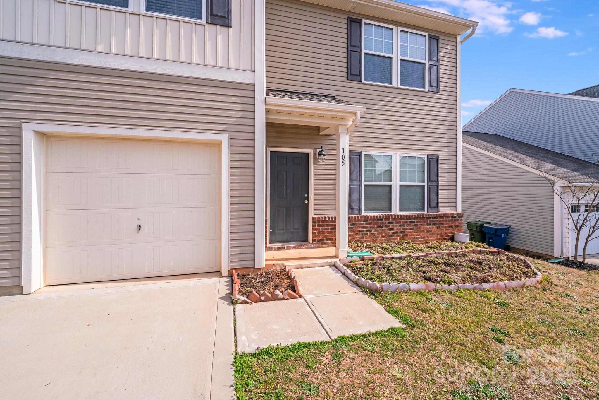 105 Abel Peterson Drive Mount Holly, NC 28120 - Photo 3 of 36 a front view of a house with a yard