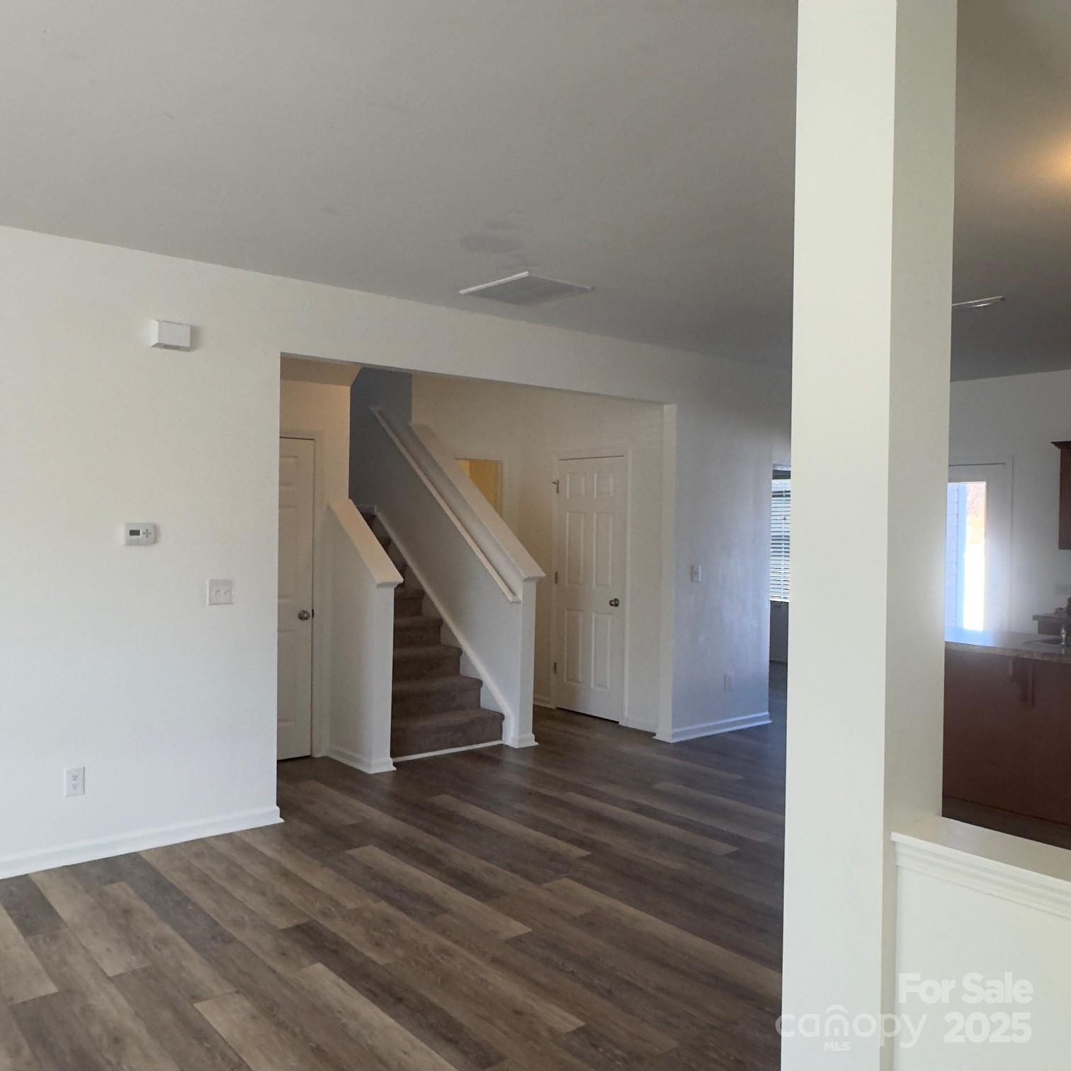 105 Abel Peterson Drive Mount Holly, NC 28120 - Photo 34 of 36 a view of entryway and hall with wooden floor