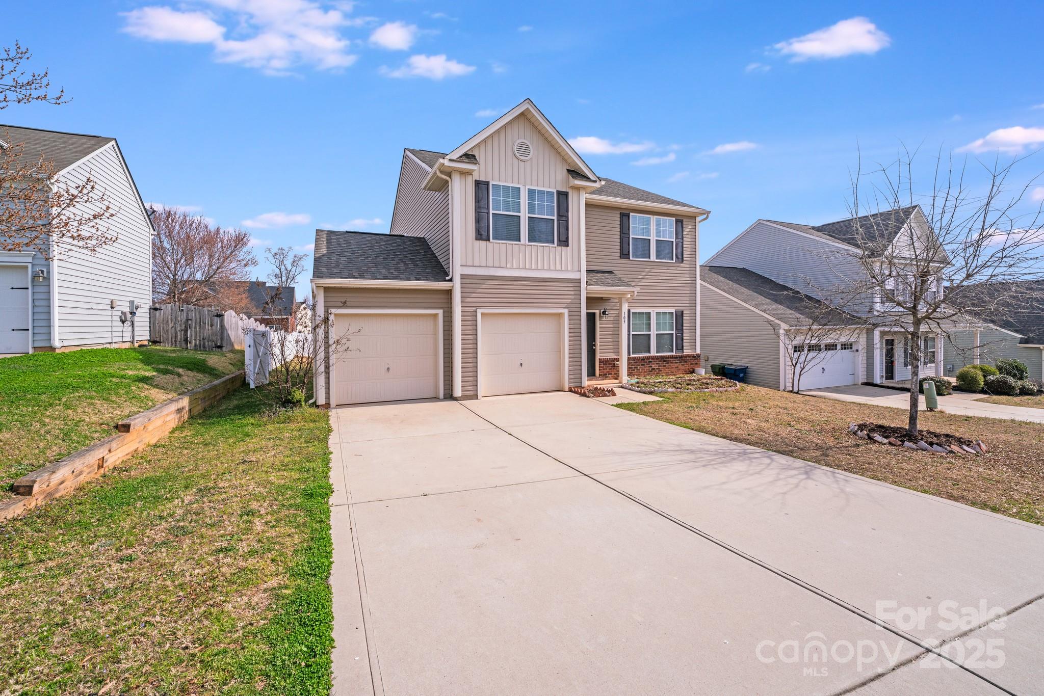 105 Abel Peterson Drive Mount Holly, NC 28120 - Photo 4 of 36 a front view of a house with a yard
