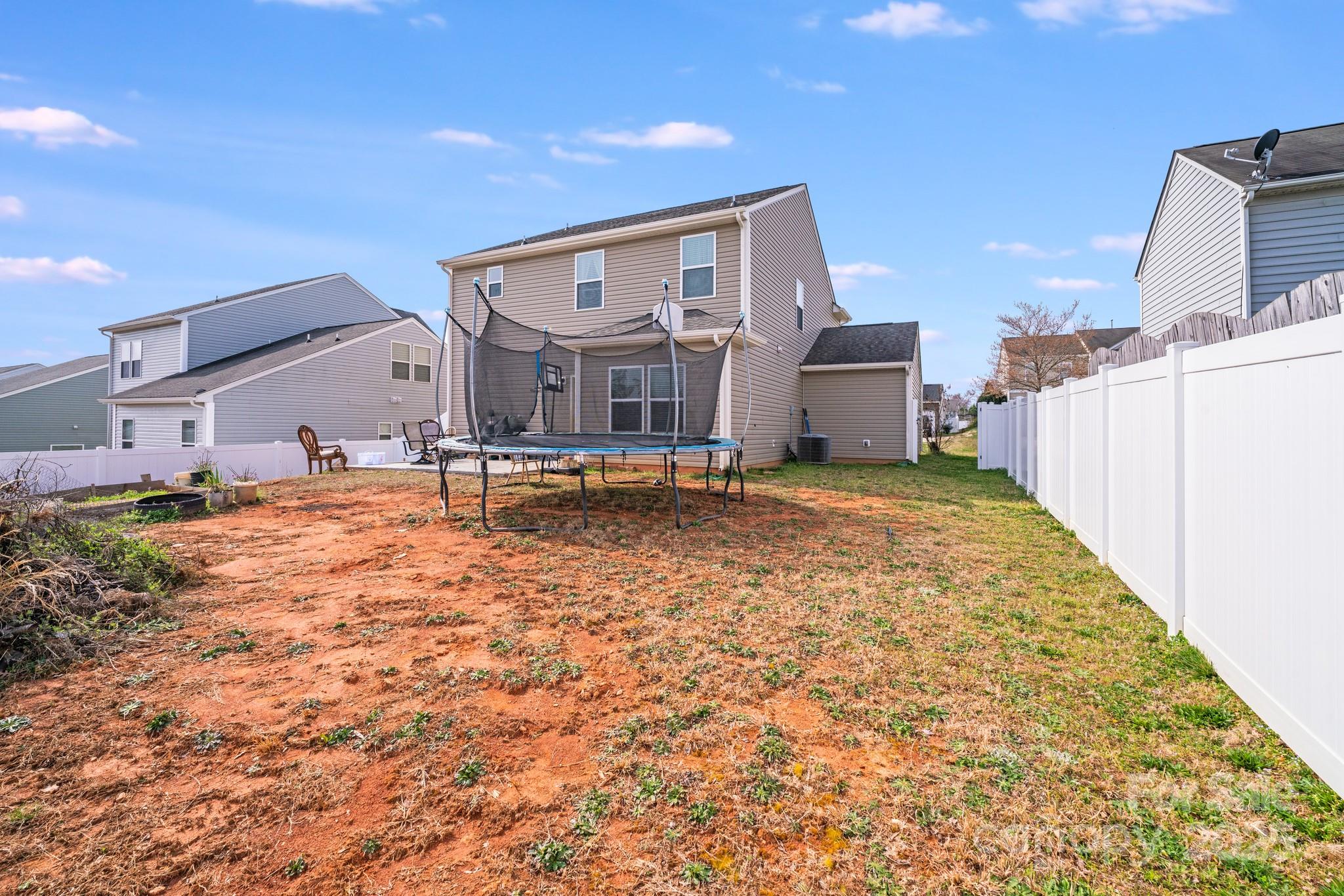 105 Abel Peterson Drive Mount Holly, NC 28120 - Photo 5 of 36 a house view with a outdoor space