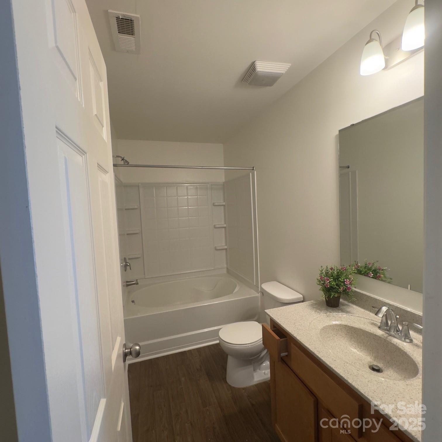 105 Abel Peterson Drive Mount Holly, NC 28120 - Photo 9 of 36 a bathroom with a granite countertop sink toilet and shower