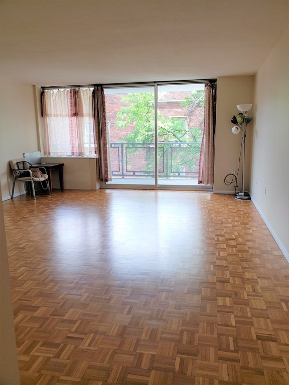 80 Salisbury Street, Unit 303 Worcester, MA 01609 - Photo 9 of 17 an empty room with windows and floor to ceiling window