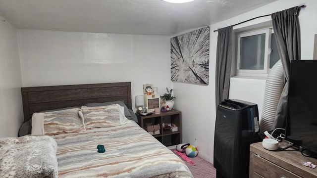 a bathroom with a sink mirror and a toilet