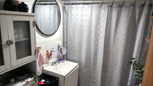 a view of a patio with table and chairs under an umbrella