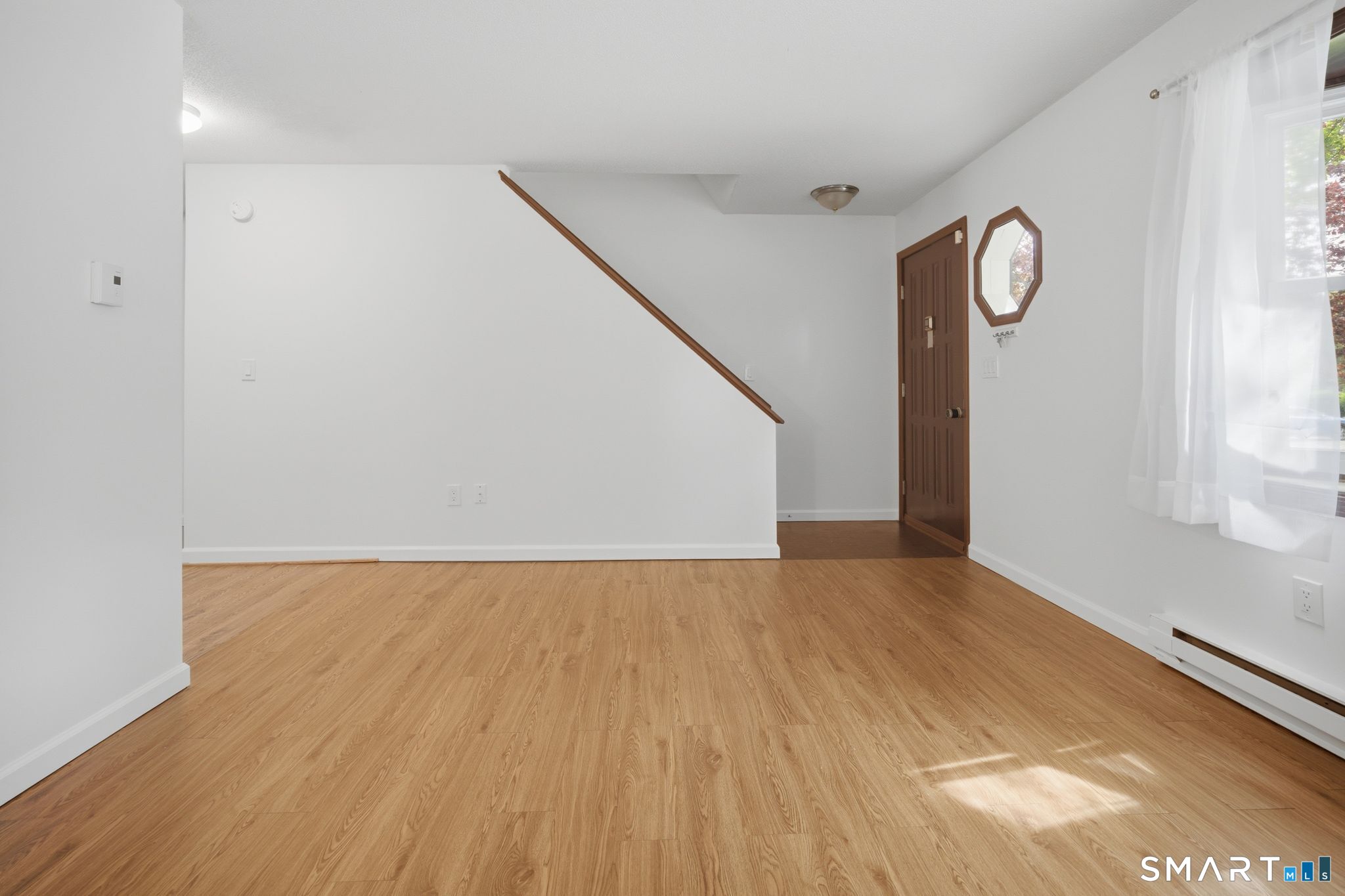 1 Abbott Road, Unit 112 Ellington, CT 06029 - Photo 2 of 16 Front entrance into the living room