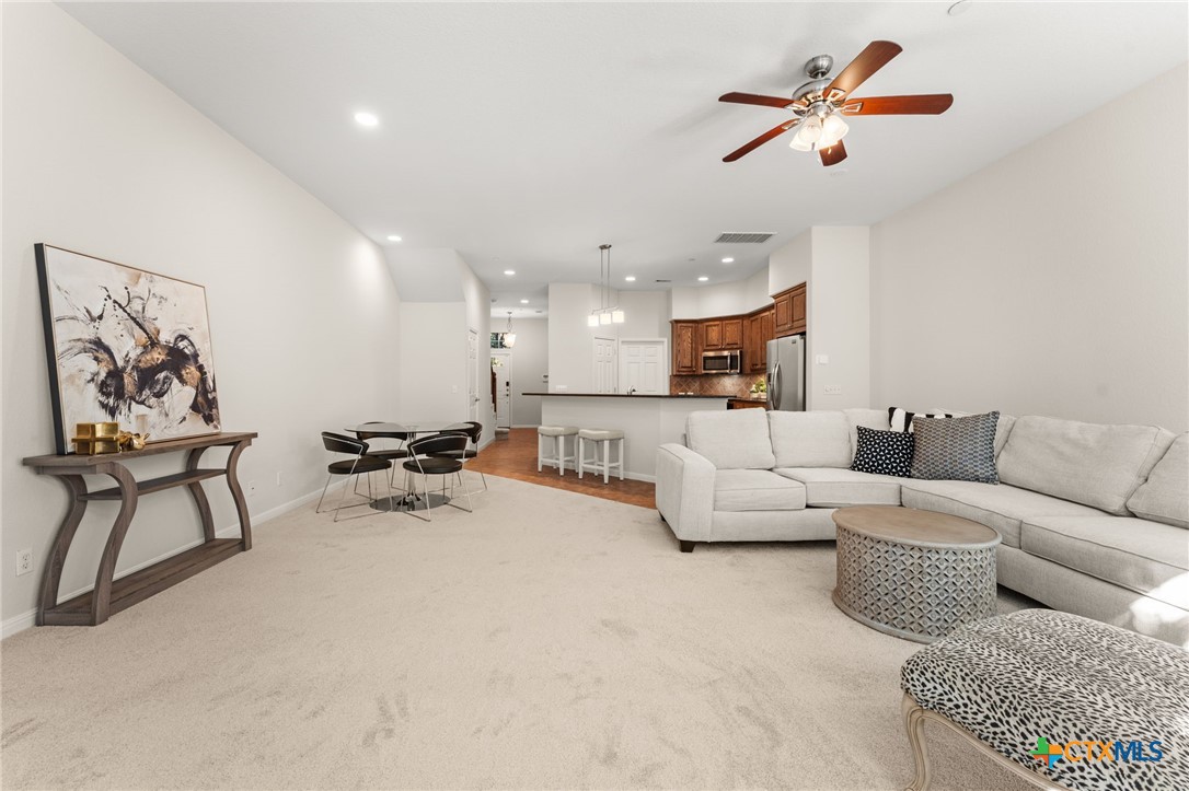 10300 Morado Cove, Unit 503 Austin, TX 78759 - Photo 12 of 33 The living, dining, and kitchen spaces flow seamlessly.