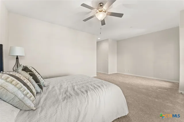 a large kitchen with stainless steel appliances granite countertop a stove a sink and a refrigerator