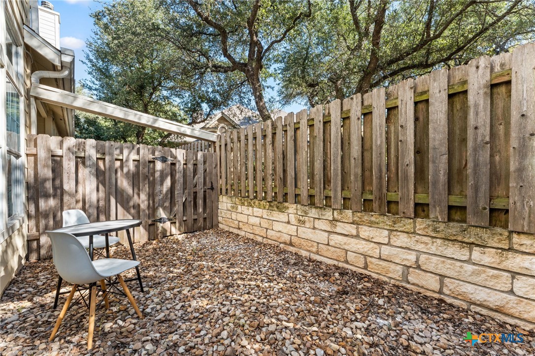 10300 Morado Cove, Unit 503 Austin, TX 78759 - Photo 20 of 33 Another angle of the fenced backyard space.