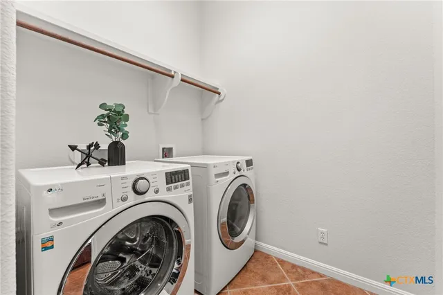 a view of a backyard with a wooden fence