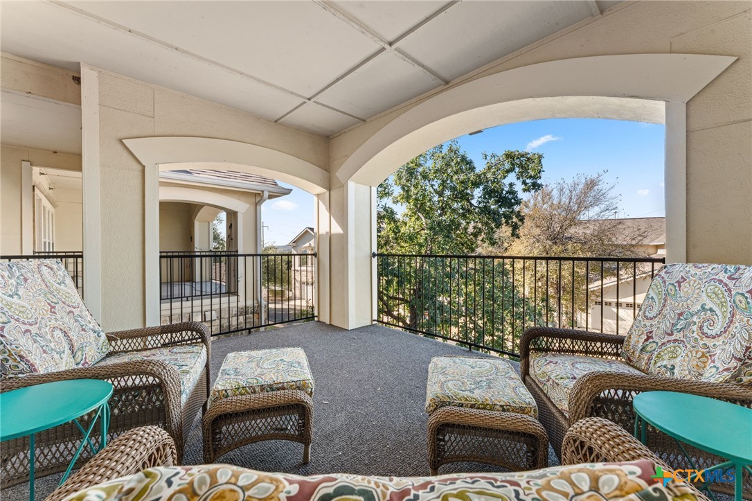 10300 Morado Cove, Unit 503 Austin, TX 78759 - Photo 2 of 33 The primary suite has a large balcony accessible from the primary bedroom.