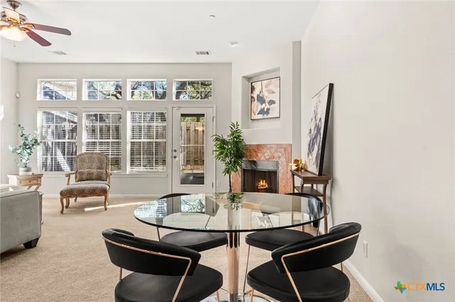 a kitchen with kitchen island granite countertop a stove sink and refrigerator