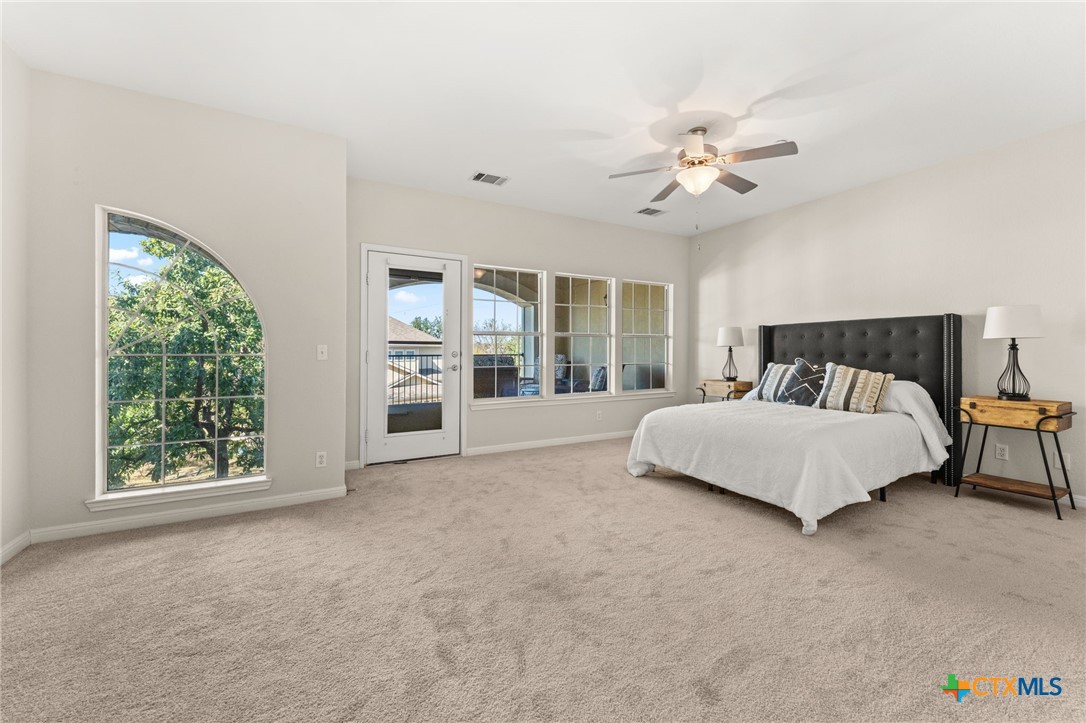 10300 Morado Cove, Unit 503 Austin, TX 78759 - Photo 5 of 33 The primary bedroom is enormous with large windows.