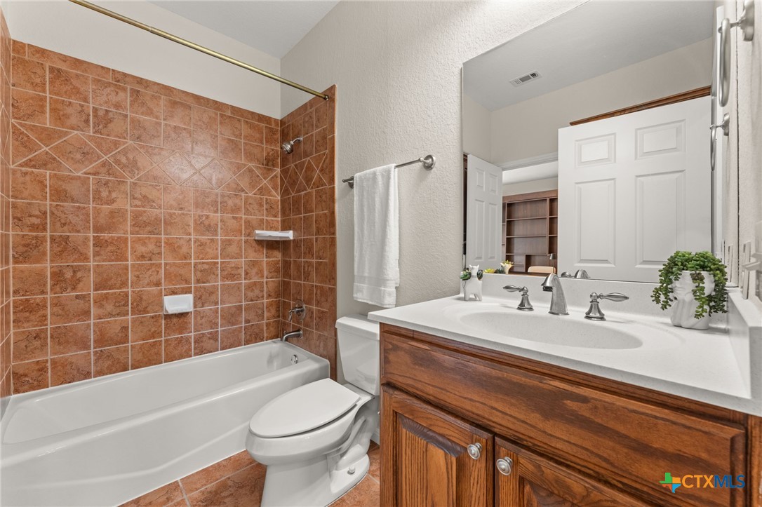 10300 Morado Cove, Unit 503 Austin, TX 78759 - Photo 9 of 33 The full guest bathroom is located upstairs near the guest bedroom.