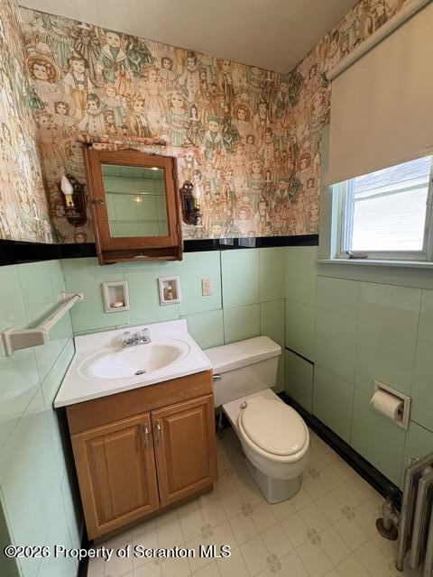 706 Delaware Street Forest City, PA 18421 - Photo 21 of 33 a bathroom with a toilet a sink and a mirror