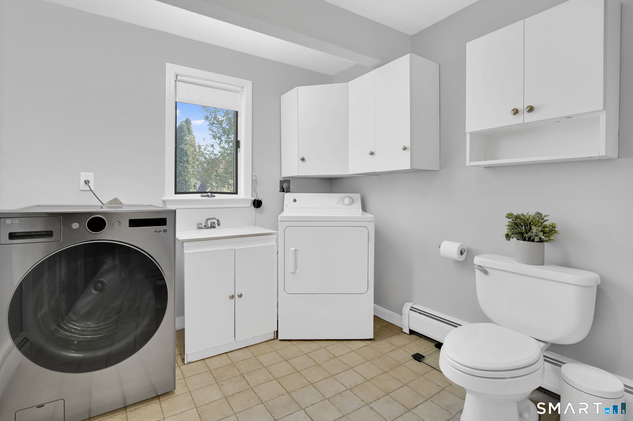 61 Cedar Street Newington, CT 06111 - Photo 28 of 39 Main floor laundry/full bathroom