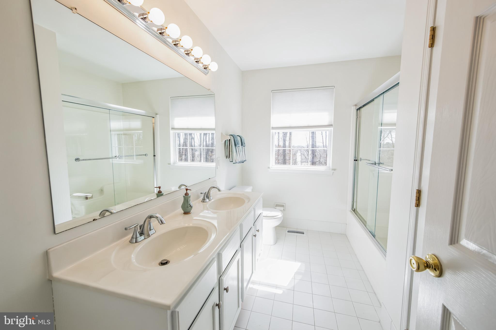 684 Highspire Road Glenmoore, PA 19343 - Photo 28 of 46 a bathroom with a sink a toilet and shower