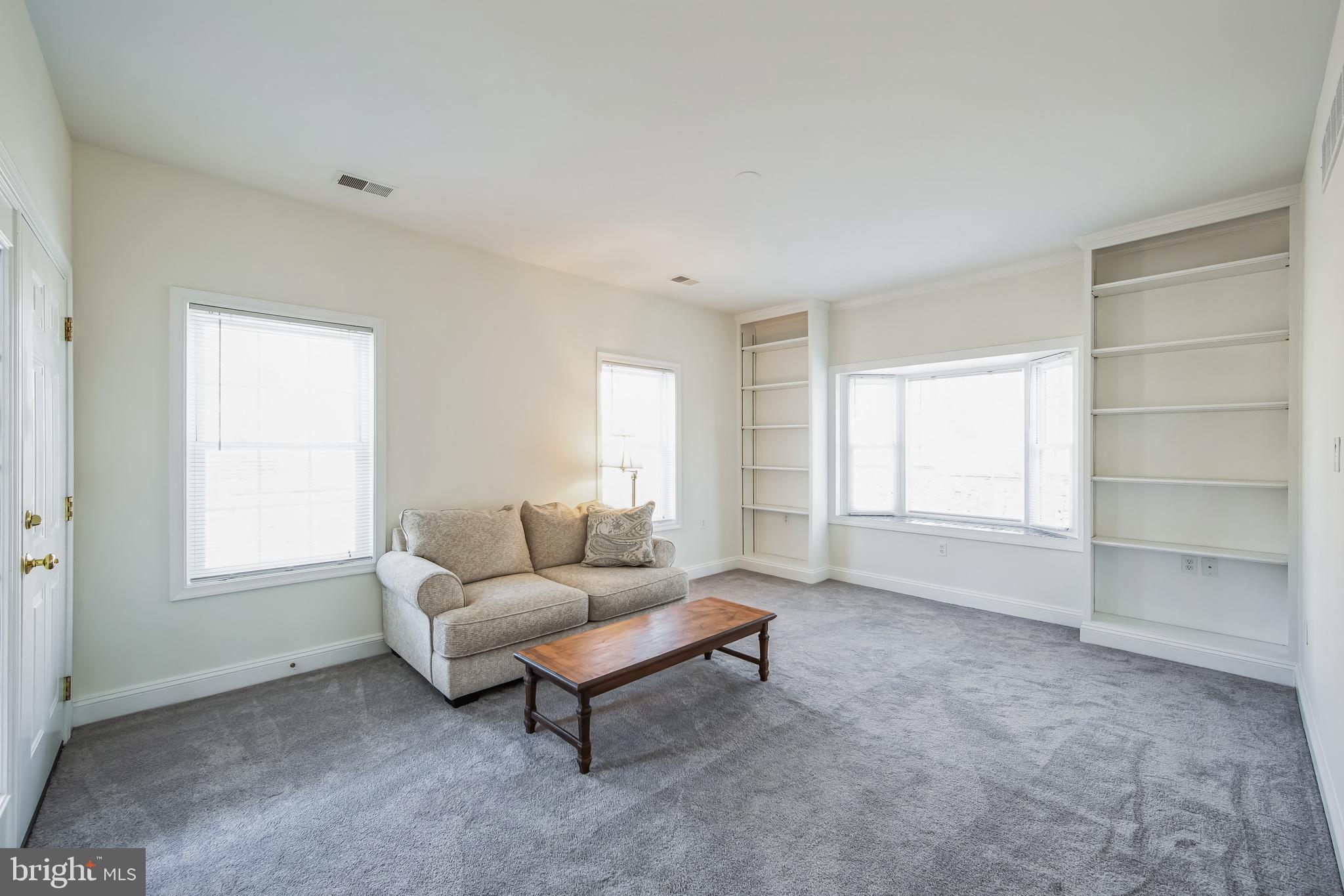 684 Highspire Road Glenmoore, PA 19343 - Photo 30 of 46 a living room with furniture and a window