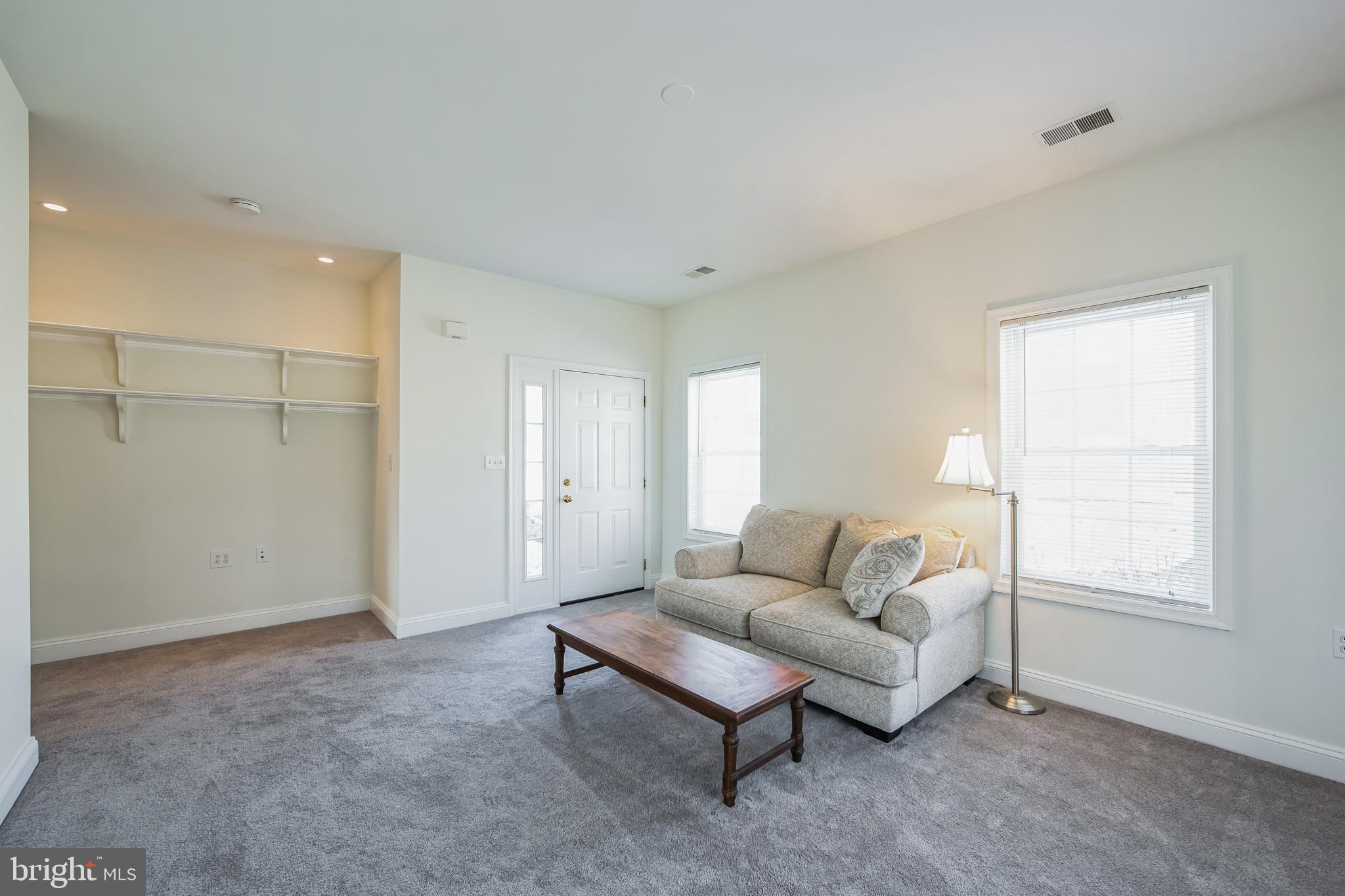 684 Highspire Road Glenmoore, PA 19343 - Photo 31 of 46 a living room with furniture and a window
