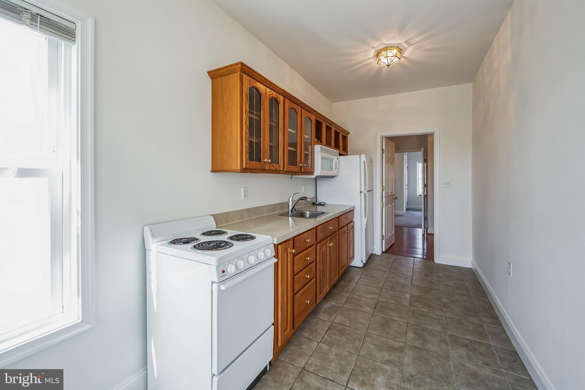 684 Highspire Road Glenmoore, PA 19343 - Photo 32 of 46 a kitchen that has a sink and a stove