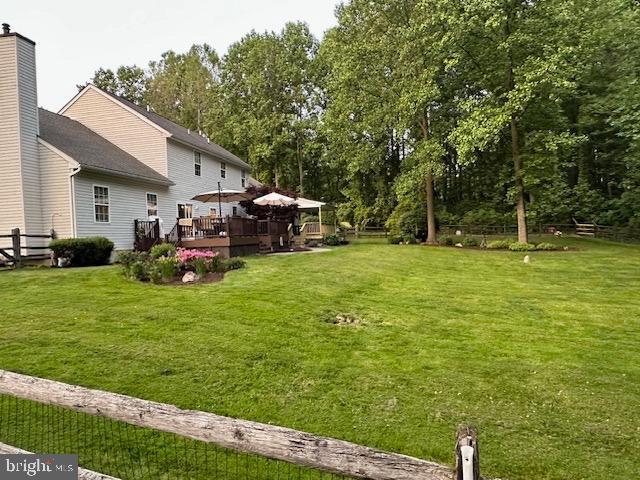 684 Highspire Road Glenmoore, PA 19343 - Photo 43 of 46 a view of a patio with table and chairs and a large tree